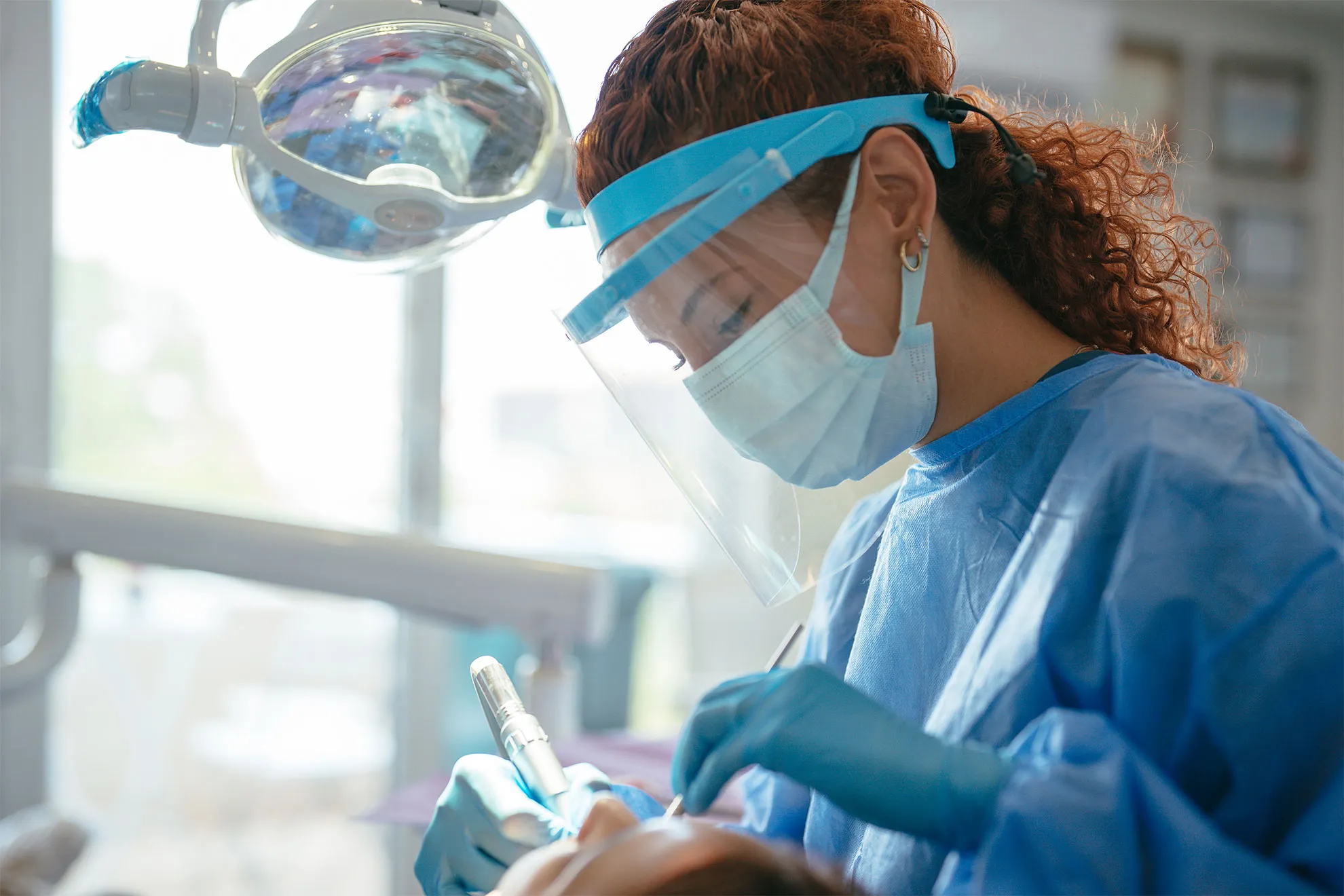 A dentist talking with a patient in a consultation